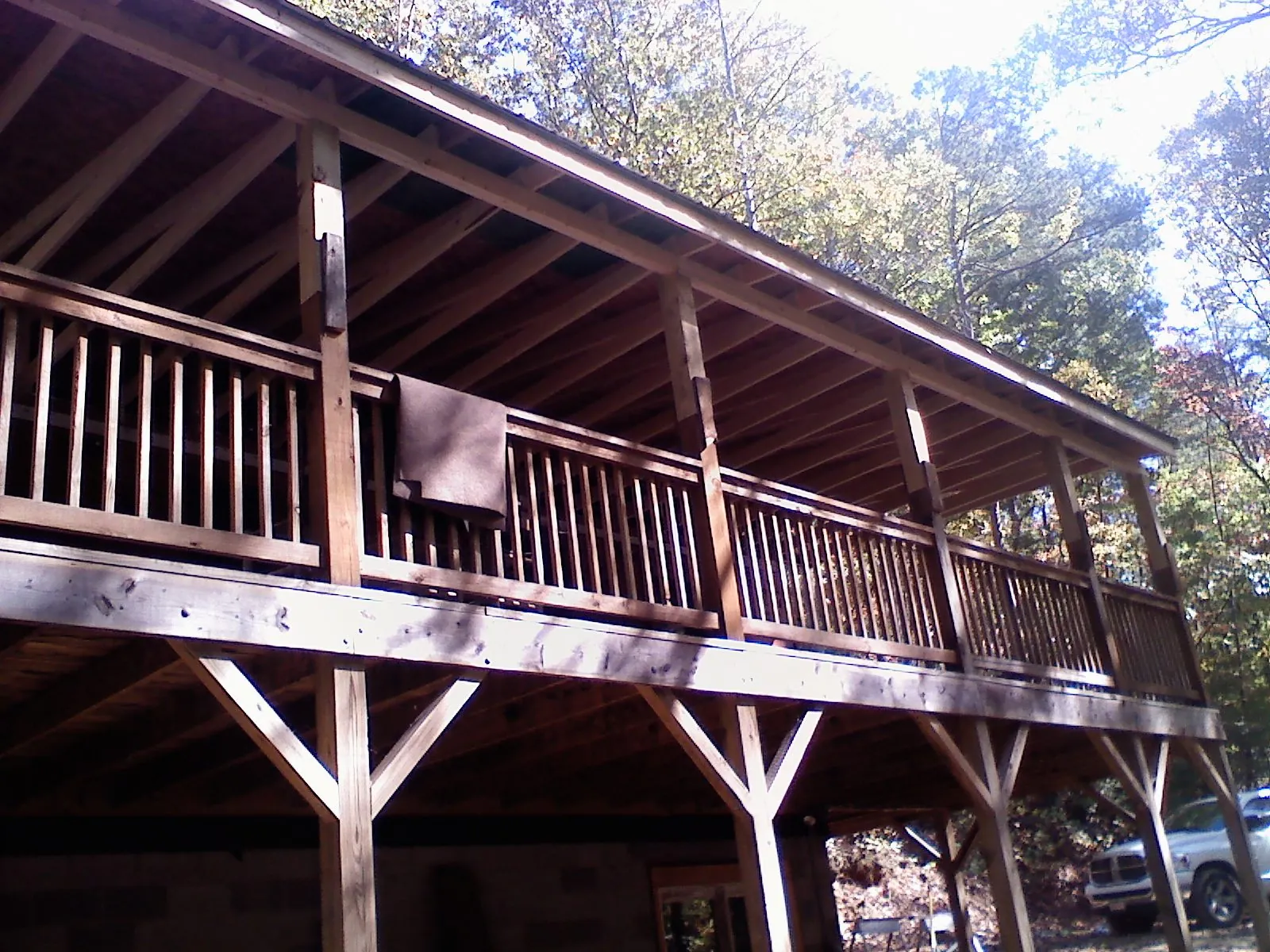 Timber framing under a new elevated porch and deck — Roof Leak Repair in Arion by Roofing Brothers